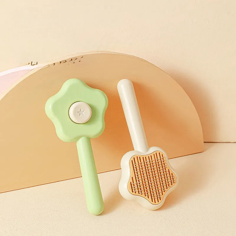 Large green self-cleaning cat comb magic wand with stainless steel needle teeth for pet grooming.