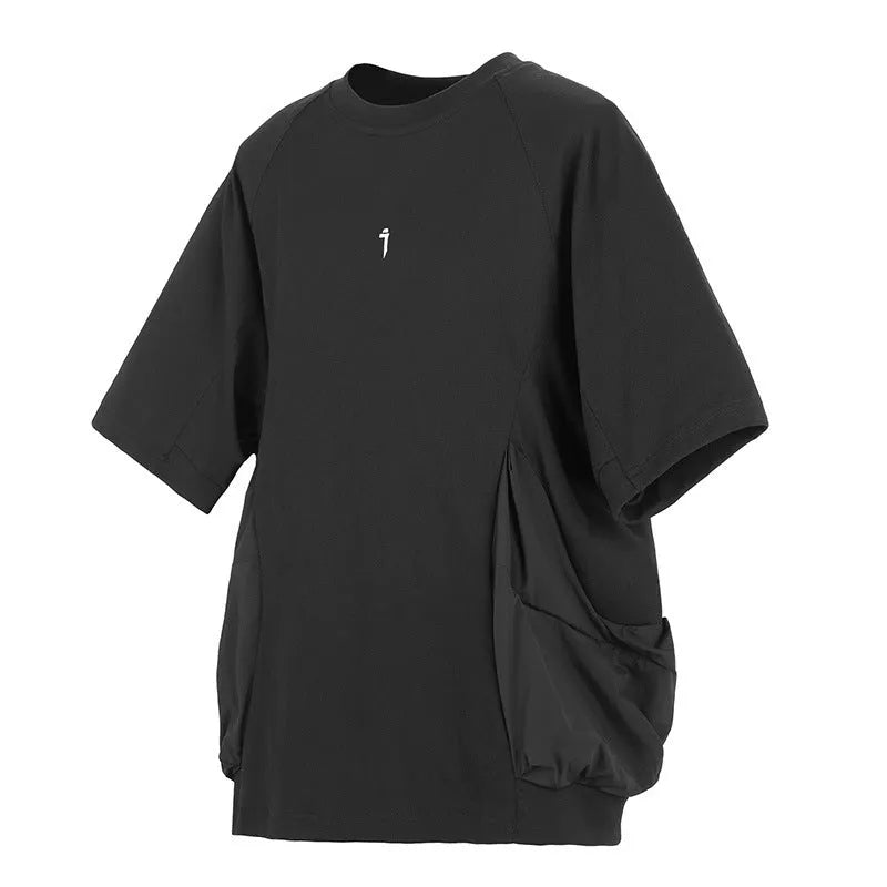 Men's loose grey cotton t-shirt with large chest pockets and short sleeves on a mannequin.