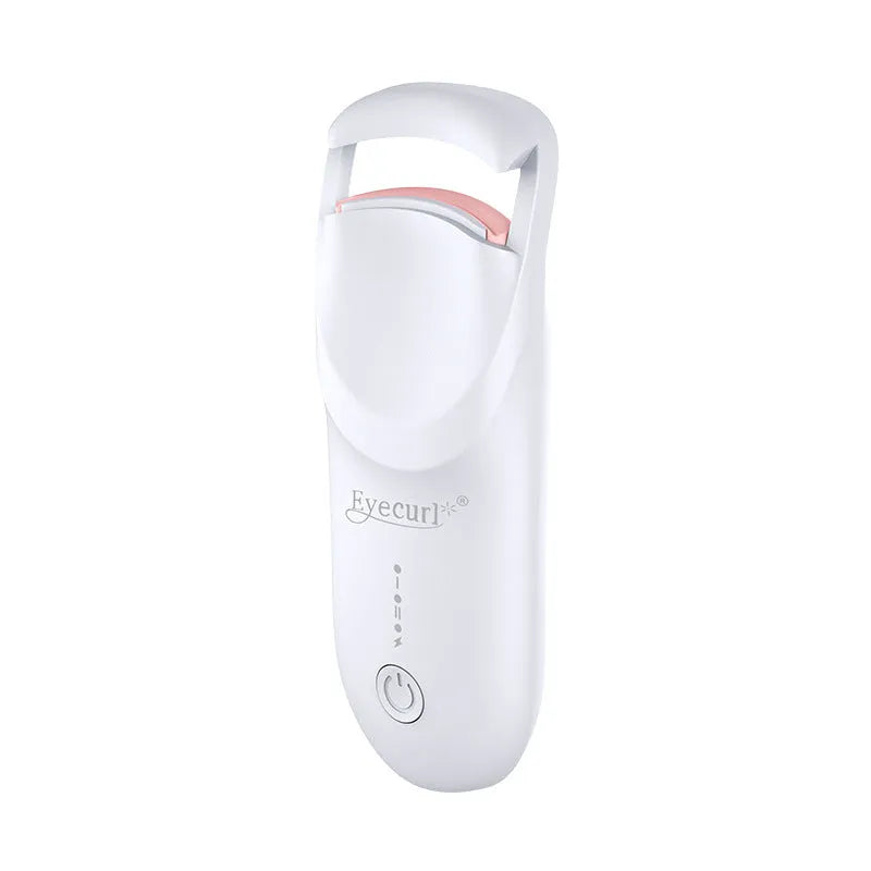 Electric heating eyelash curler in plastic housing with USB cable on a vanity