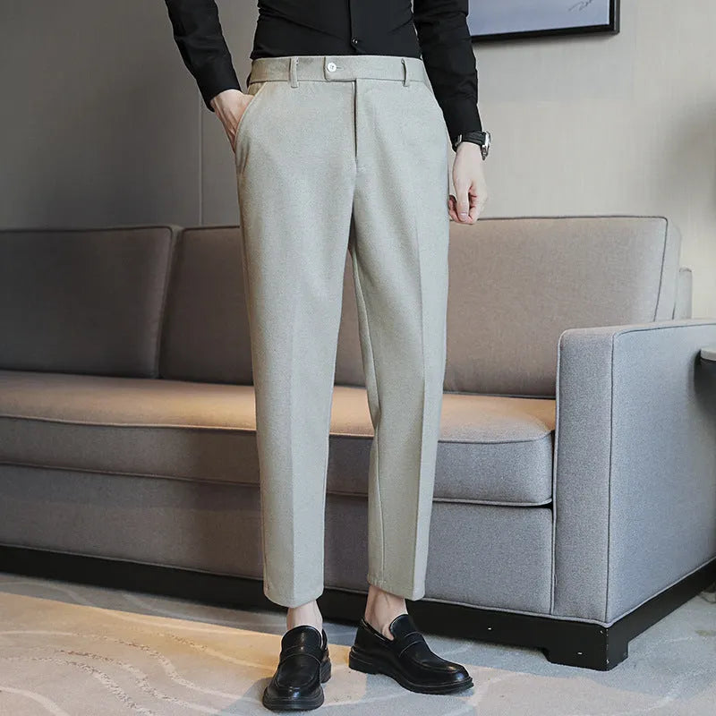 Retro brown straight leg corduroy trousers with elastic waistband laid flat.