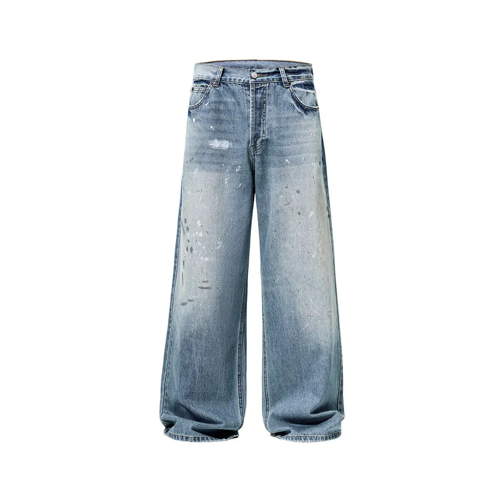 Men's loose fit splash-ink washed denim jeans in Ice Blue on a model, front view