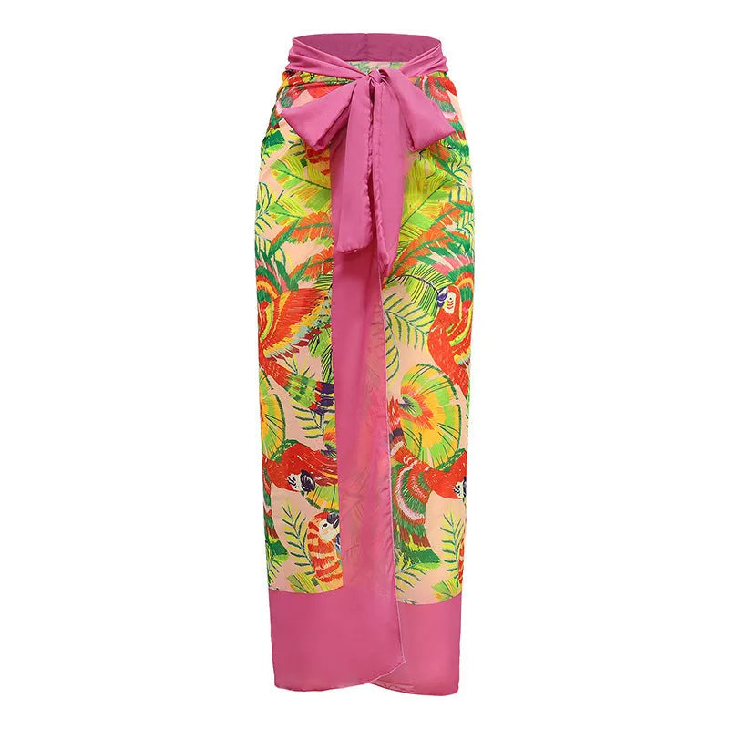 Women's pink floral print one-piece swimsuit with v-neck, covered belly, and attached thin skirt.