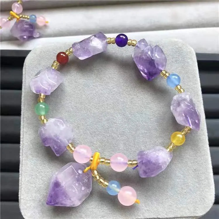 Women's amethyst bead bracelet with fu character charm and natural shaped beads