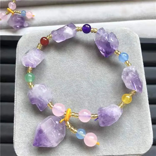 Women's amethyst bead bracelet with fu character charm and natural shaped beads