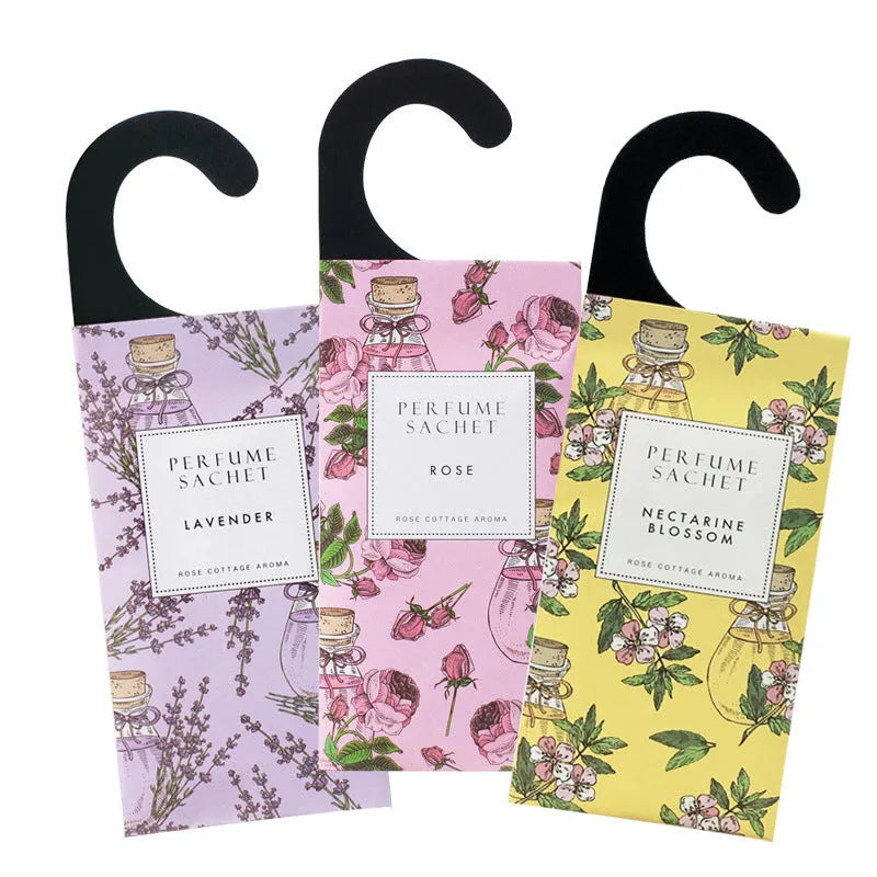 Five 30g lavender and rose scented wardrobe sachets on a shelf, each measuring 21x8cm