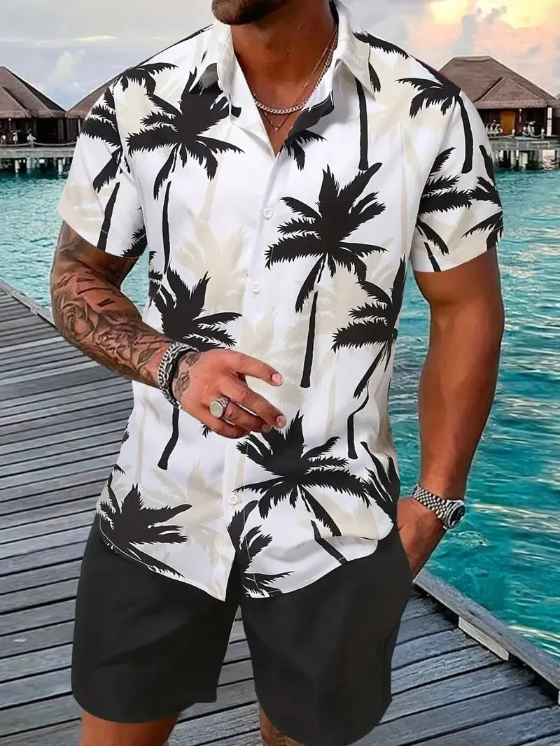 Man wearing a blue Hawaiian print short sleeve shirt and matching shorts from the casual suit set.