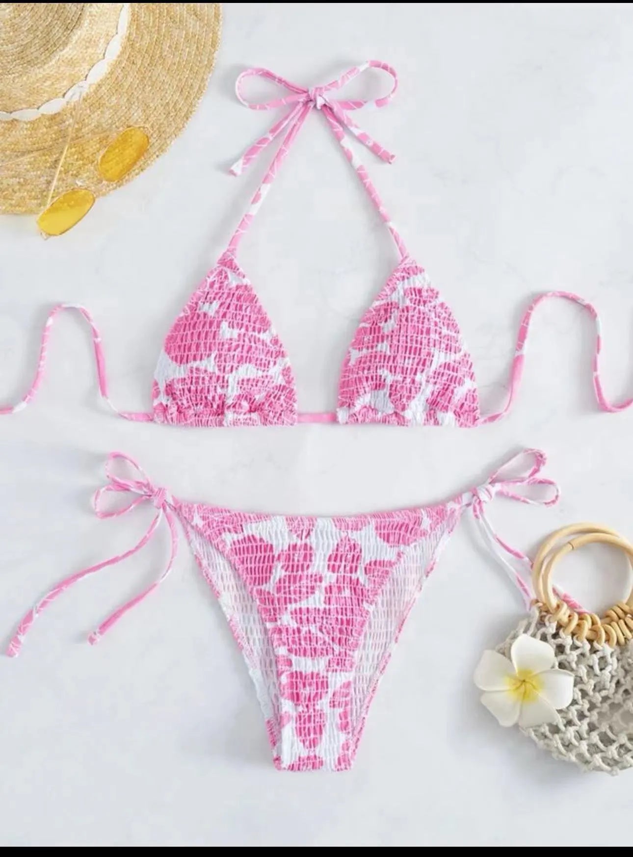Women's floral patterned halter-neck bikini set in multiple colours on a mannequin