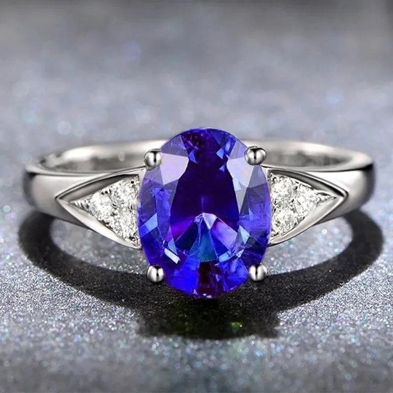 Women's court ring with natural zircon inlay showing heart, water drop and bell patterns in blue colour option