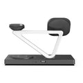 White five-in-one wireless charging station with night lamp, magnetic phone bracket, circular base, and watch charger.