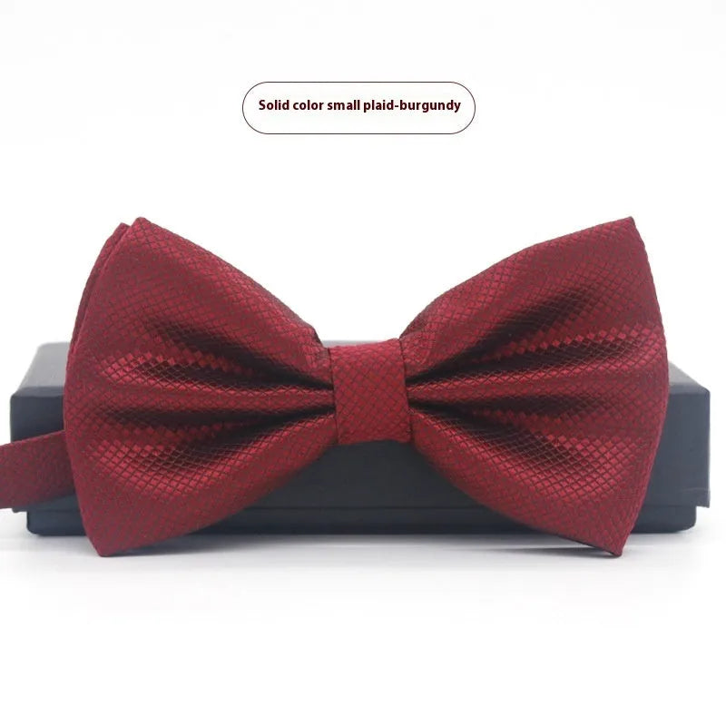 Solid colour polyester bow tie with flat head design measuring 12cm by 6cm