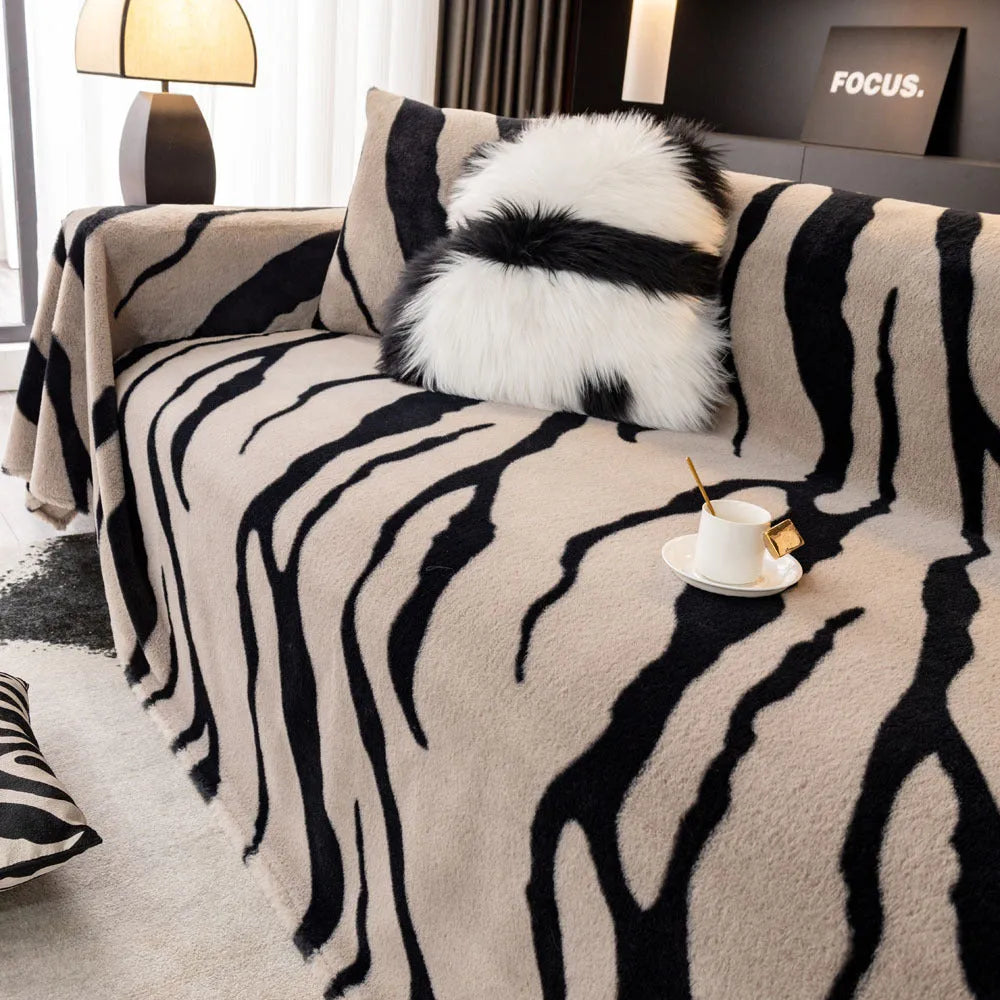 Zebra pattern flannel sofa slipcover in caramel colour showing non-slip underside and matching pillowcase