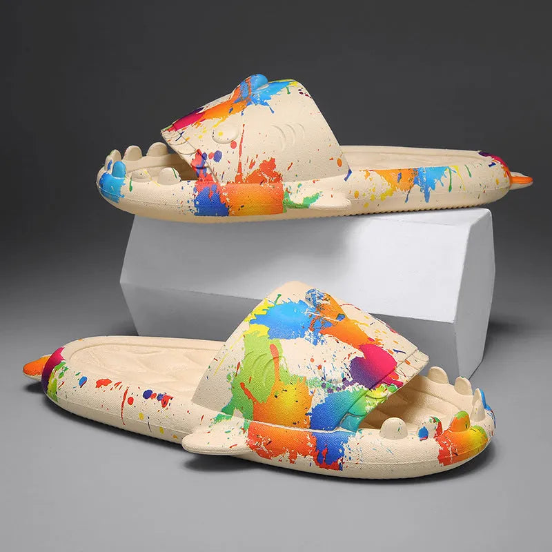 Beige and black EVA open-toe home slippers with a shark design on the front, shown as a couple's pair.