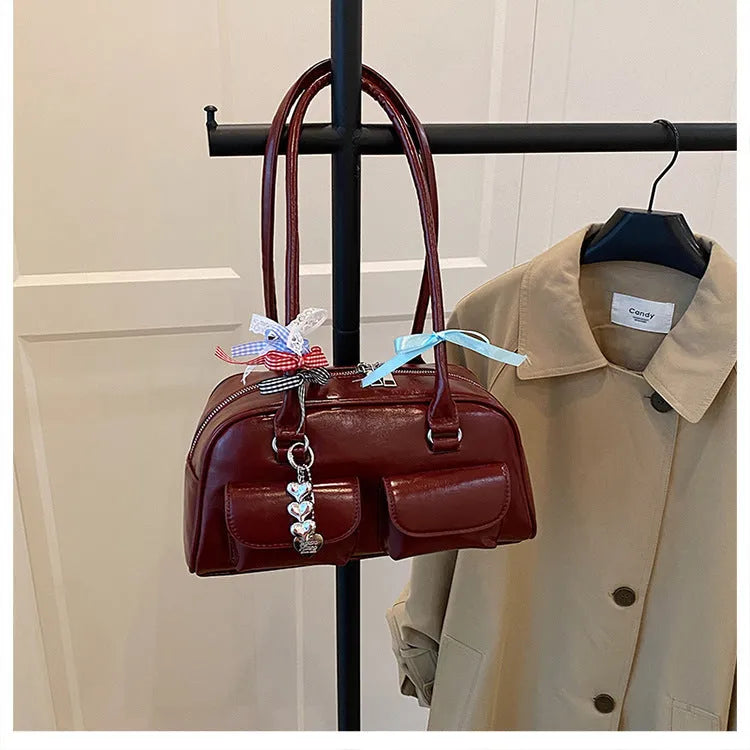 Retro brown PU leather pillow-shaped women's handbag with a flap and double shoulder strap