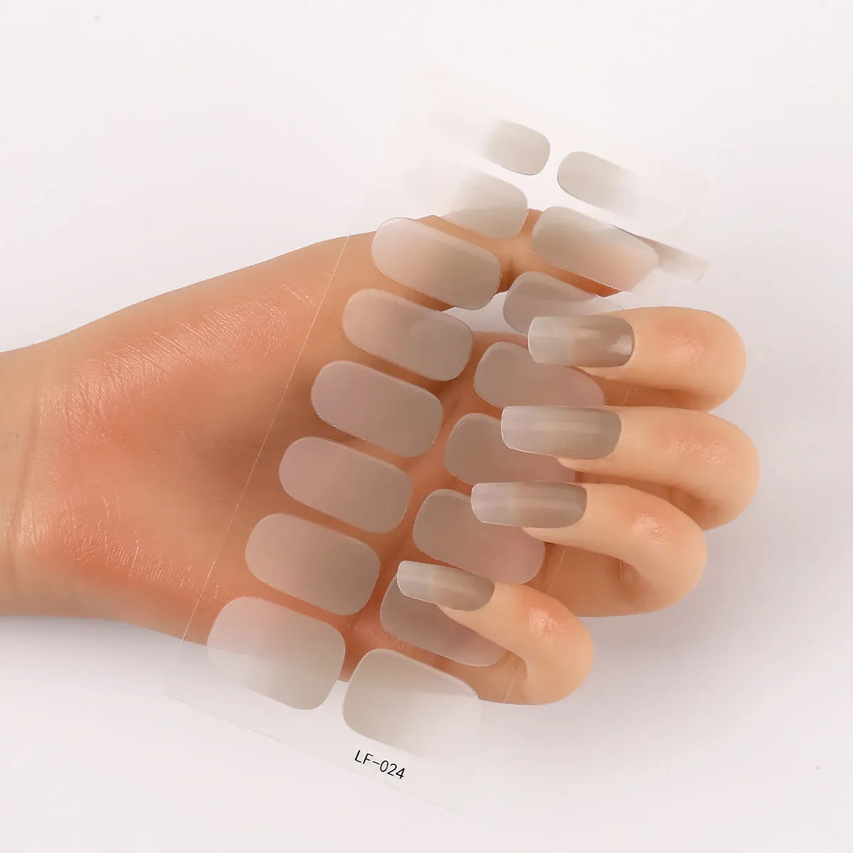 Set of 16 solid colour full nail art stickers showing patterns like cross, rose, tulip, and cartoon designs.
