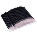 Pack of 100 black disposable eyeliner brushes with fine tips and plastic sleeves