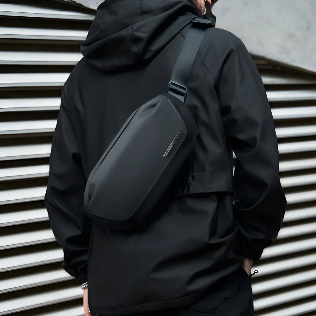 Black Oxford cloth mens messenger bag with cross-body strap and street trend styling