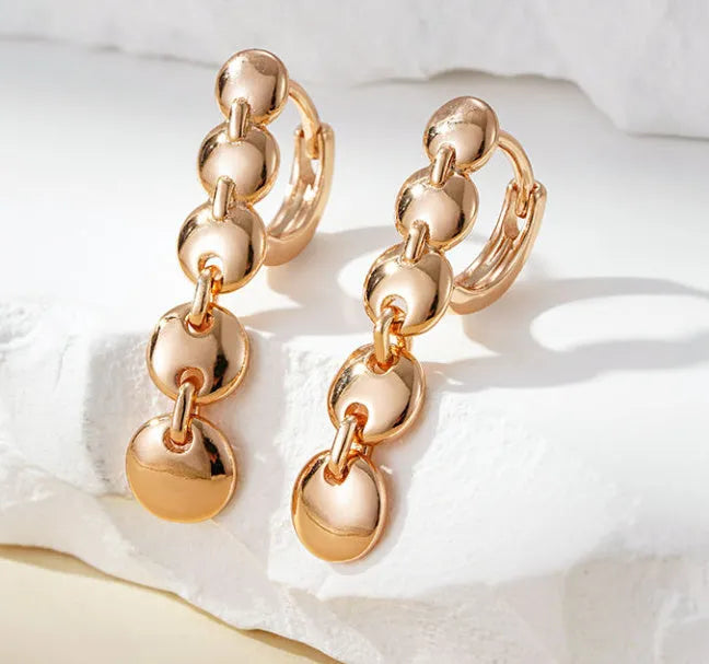 Retro gold-coloured long round circle earrings with woven copper texture and drop dangle design