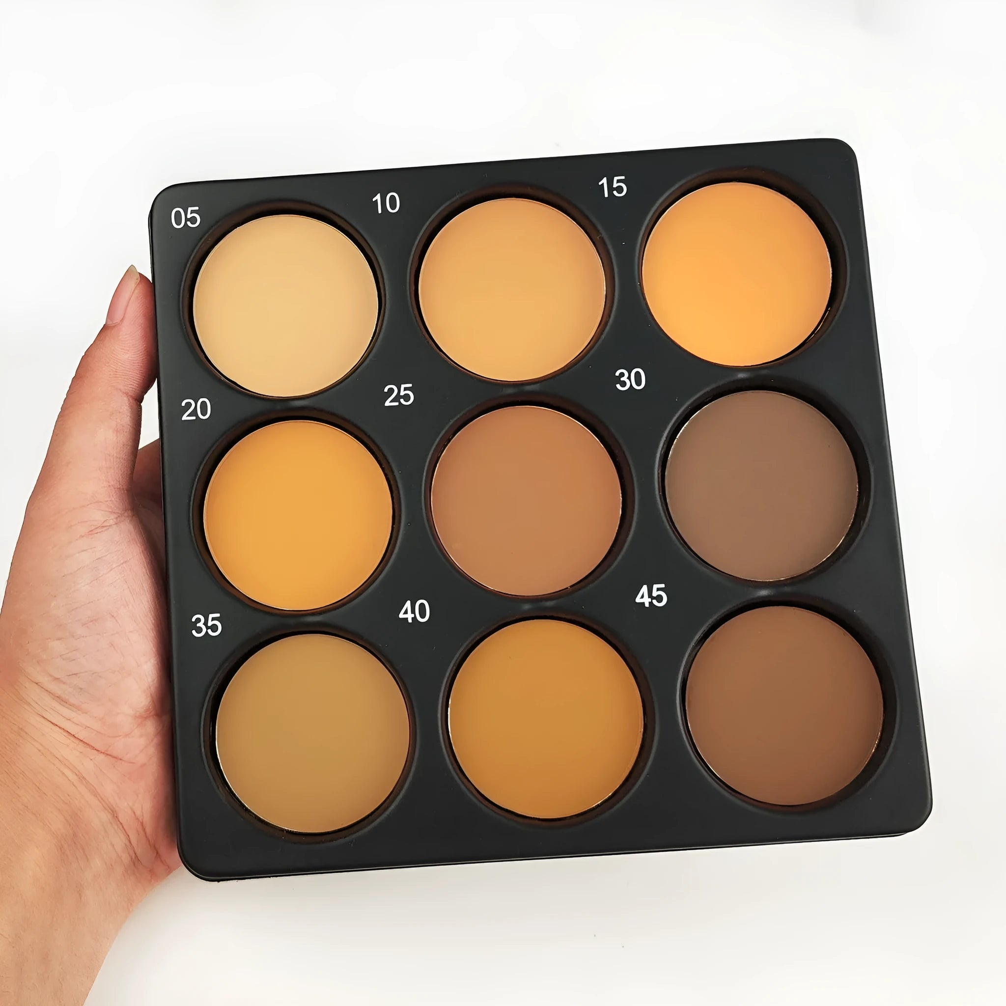 Dark matte makeup palette with nine waterproof colours in a repair disk case.