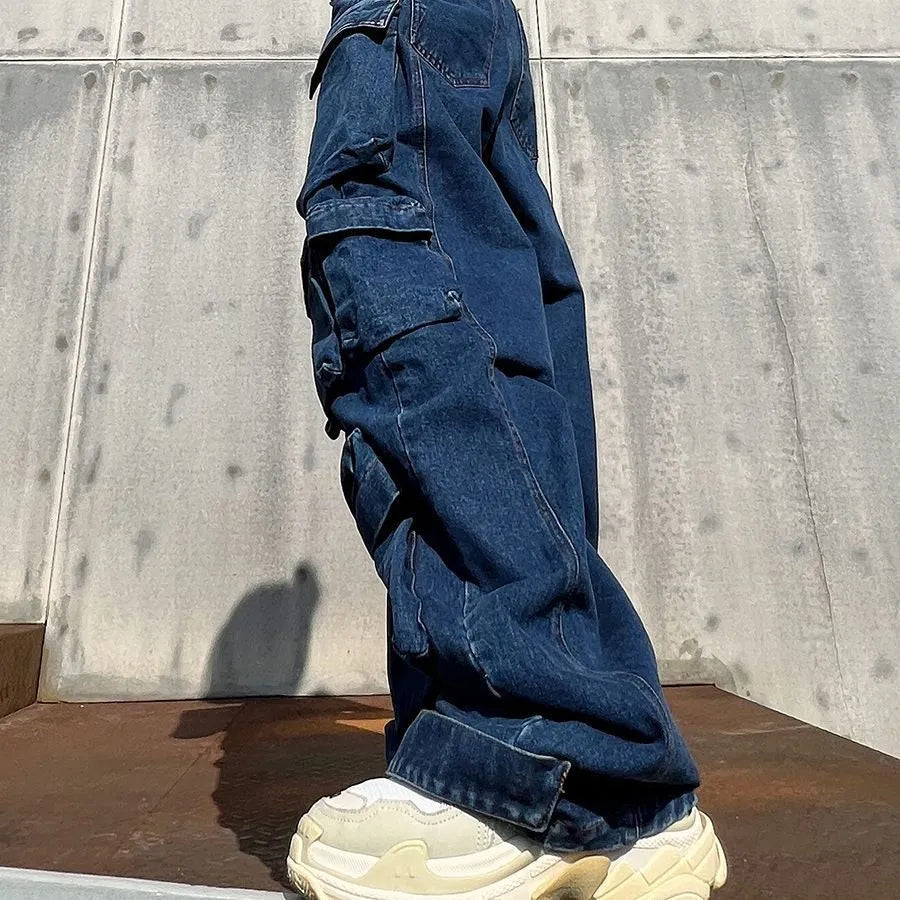 Dark blue distressed women's jeans with a high waist, wide legs, and multiple pockets on a mannequin.