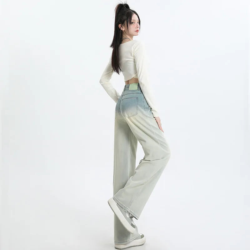 Women's gradient blue straight-leg denim trousers with wide leg silhouette on hanger
