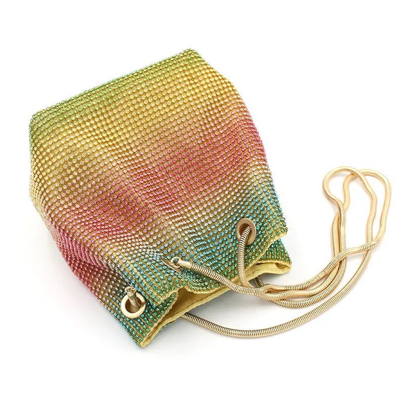 Colourful rainbow design rhinestone bucket bag with a soft fabric texture and a handle.