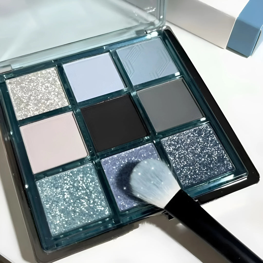 MUGELEEN nine-colour eye shadow palette showing low saturation blue smoked tones with matte and shimmer textures