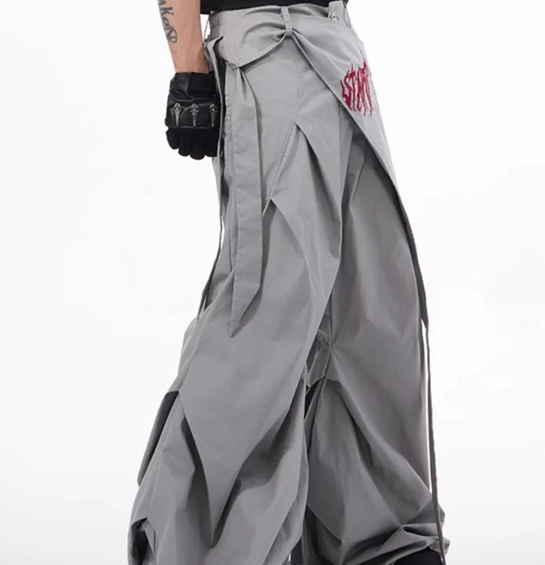 Boy modelling black wide-leg Korean-style summer pants on a casual backdrop.