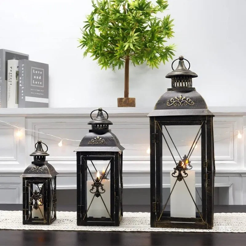 Black and white gold wrought iron storm lantern with tempered glass in three sizes for courtyard decoration.