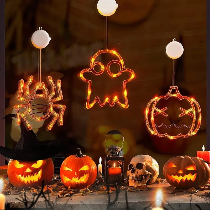 Seven Halloween LED window lights with spider, pumpkin and ghost designs on suction cups