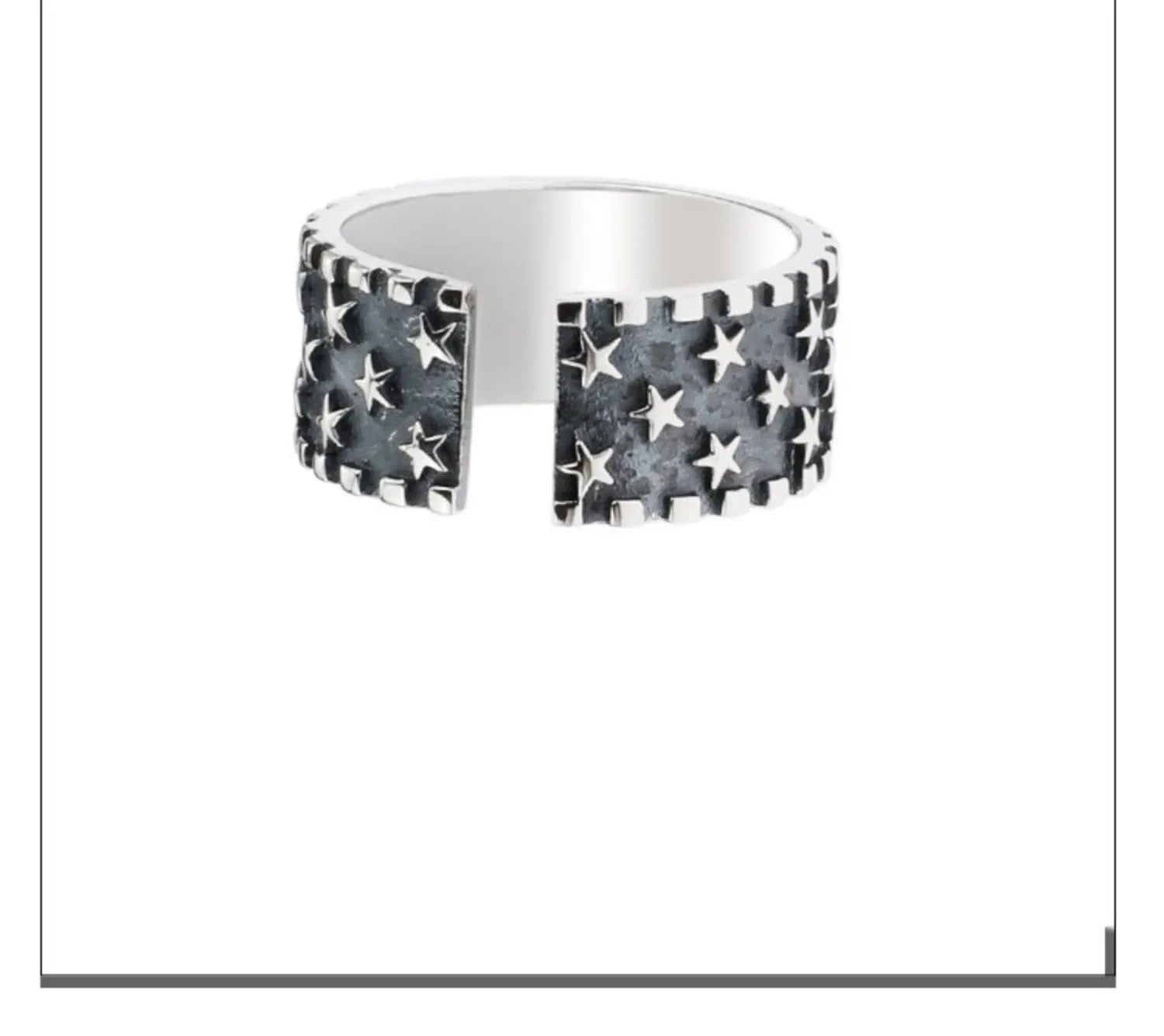 Adjustable sterling silver ring with a geometric five-pointed star pattern on a plain background.
