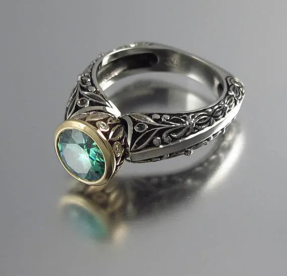 Gold-plated flower-shaped vintage ring with green silver finish and gemstone accents