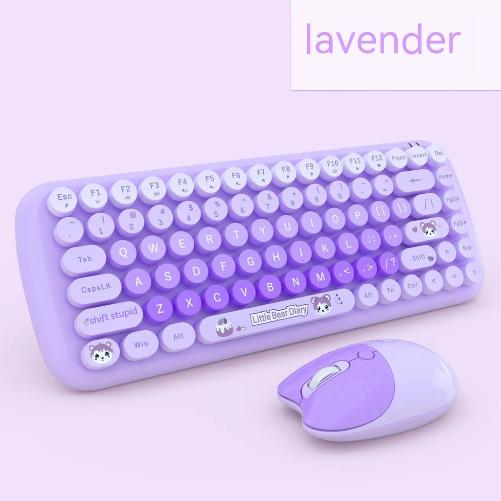 Pink mini cartoon-style wireless keyboard and mouse set on a desk with receiver.
