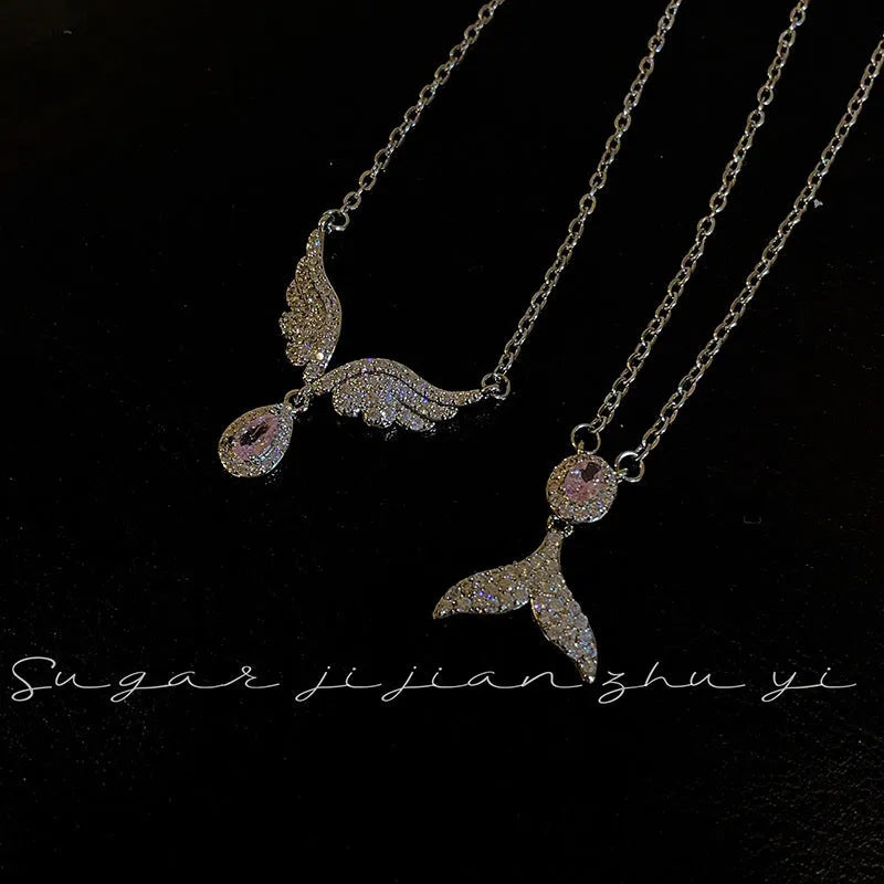 Women's sterling silver necklace with a choice of fishtail or angel wing pendant on an O-ring chain.