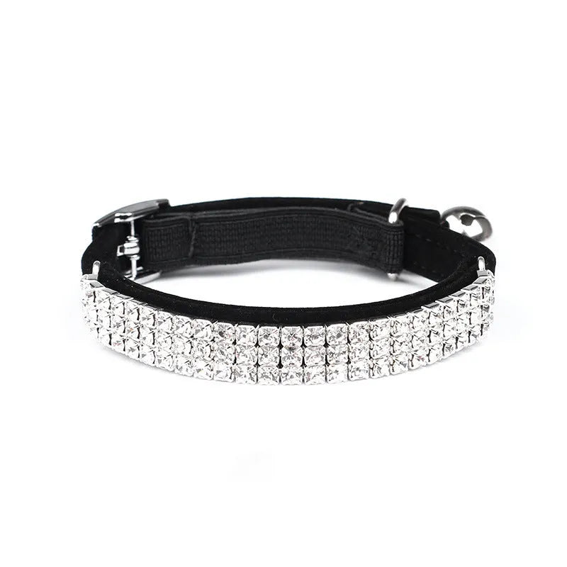 Rhinestone-studded velvet cat collar in assorted colours on a white background