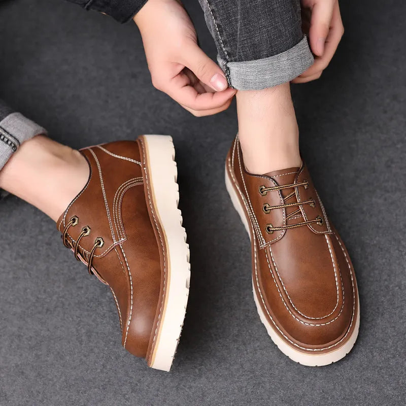 Men's black low-top casual boots with round toe and rubber sole