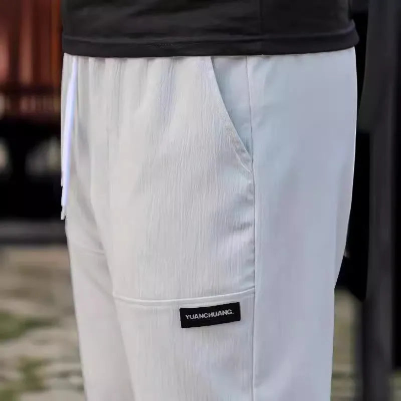 Men's polyester trousers for spring and autumn in light grey, available in sizes S to XXXL