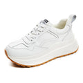 Women's beige cattlehide leather casual sports shoes with cross strap detail and mesh lining