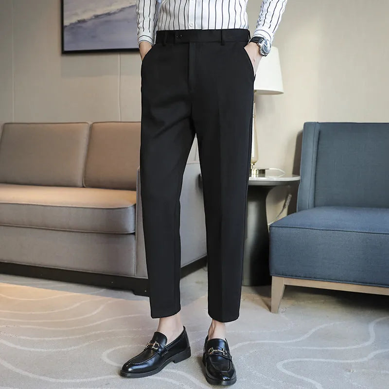 Retro brown straight leg corduroy trousers with elastic waistband laid flat.