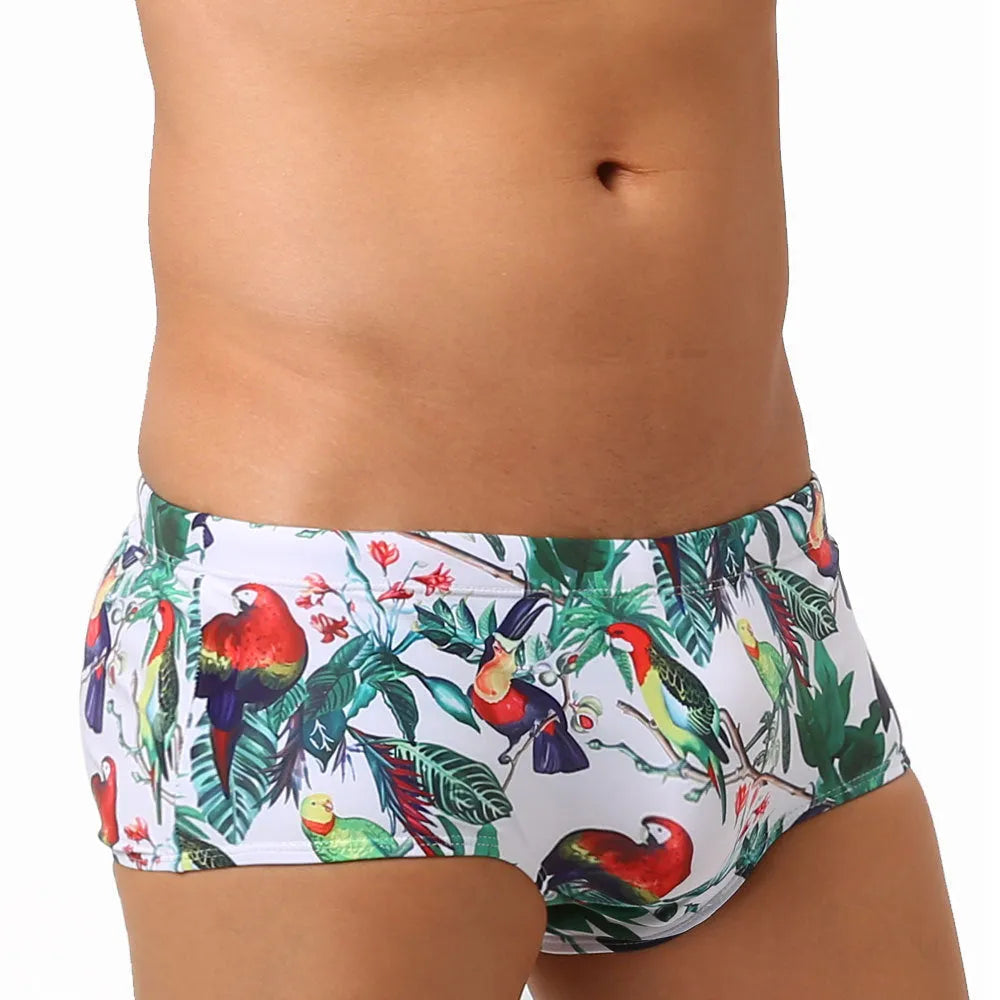 Men's floral and bird print nylon swimming trunks in boxer brief style.