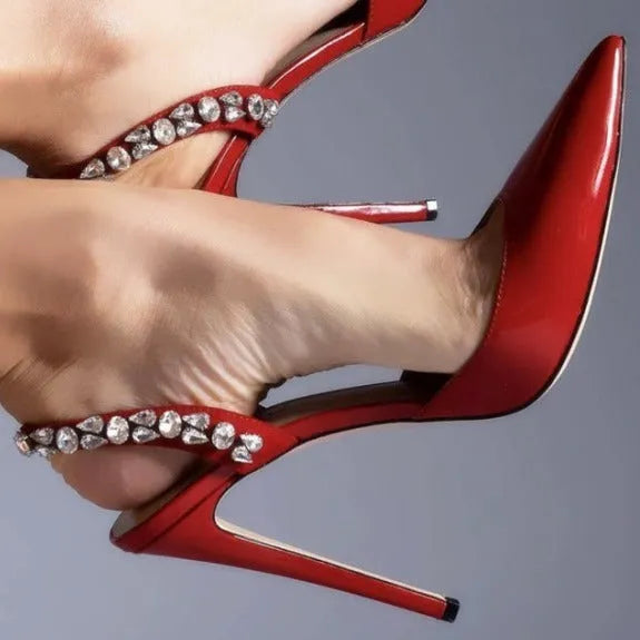 Rhinestone embellished pointed toe high heel sandals in glossy patent leather.