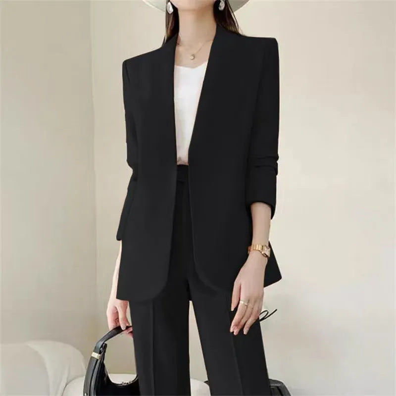 Women's polyester business suit set with blazer and trousers in beige, model standing