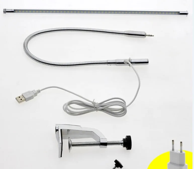Silver USB-powered LED clip-on table lamp with long arm extended, showing the lamp head and clip mount.