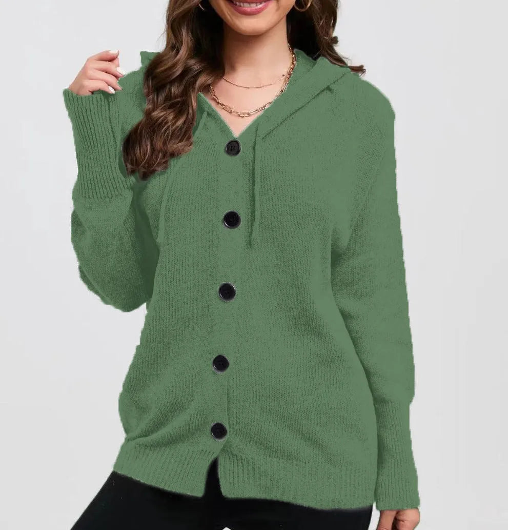 Woman wearing a loose fit, hooded, caramel-coloured cotton cardigan sweater with a textured pattern.
