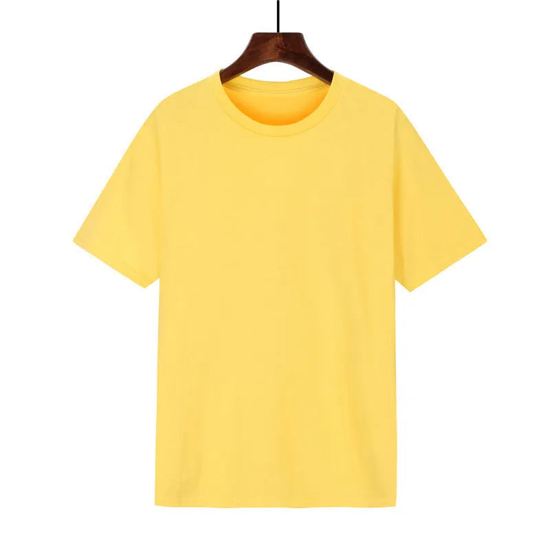 A man's loose-fitting black cotton t-shirt with short sleeves laid flat.
