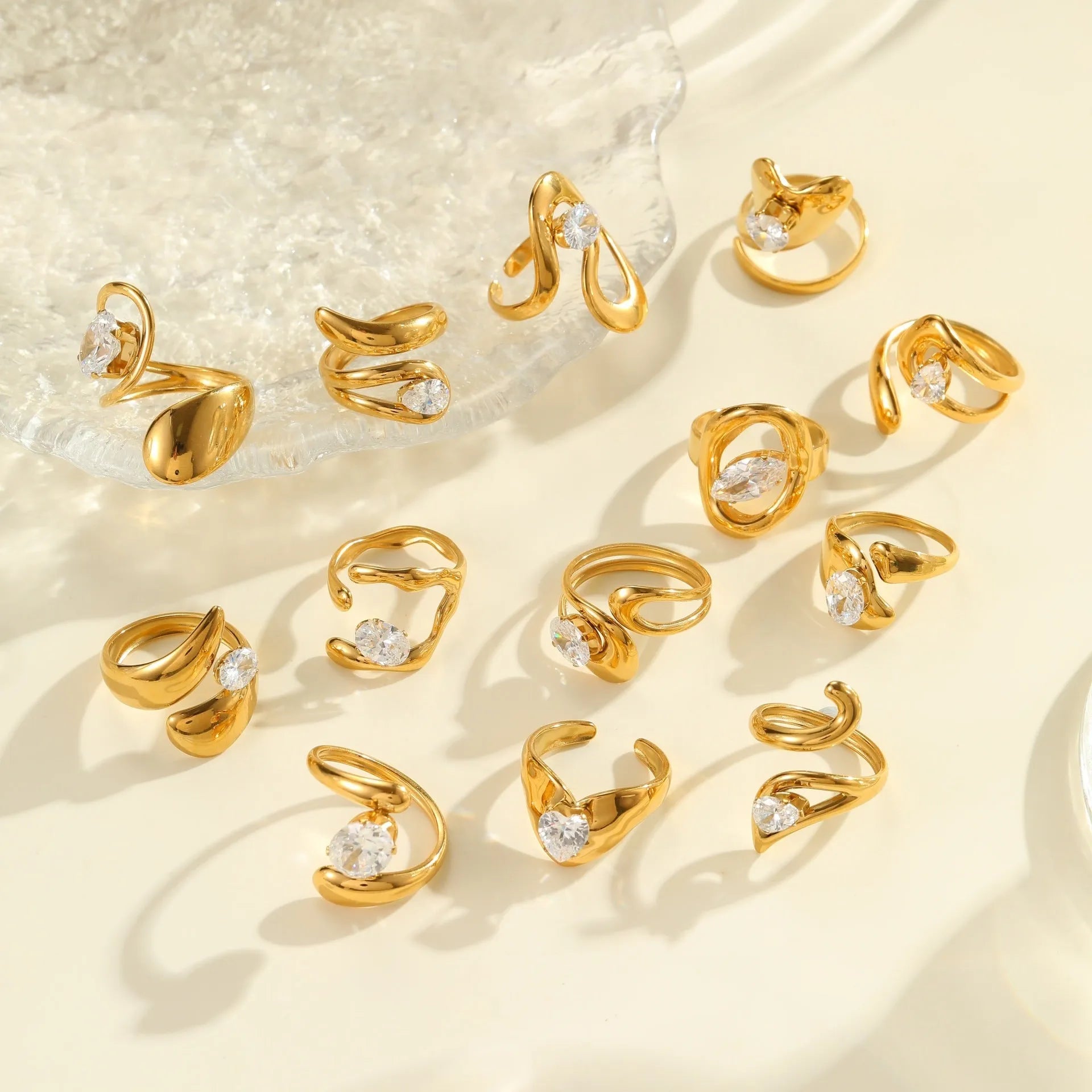 Geometric stainless steel zircon ring with open-mouth adjustable design on a hand.