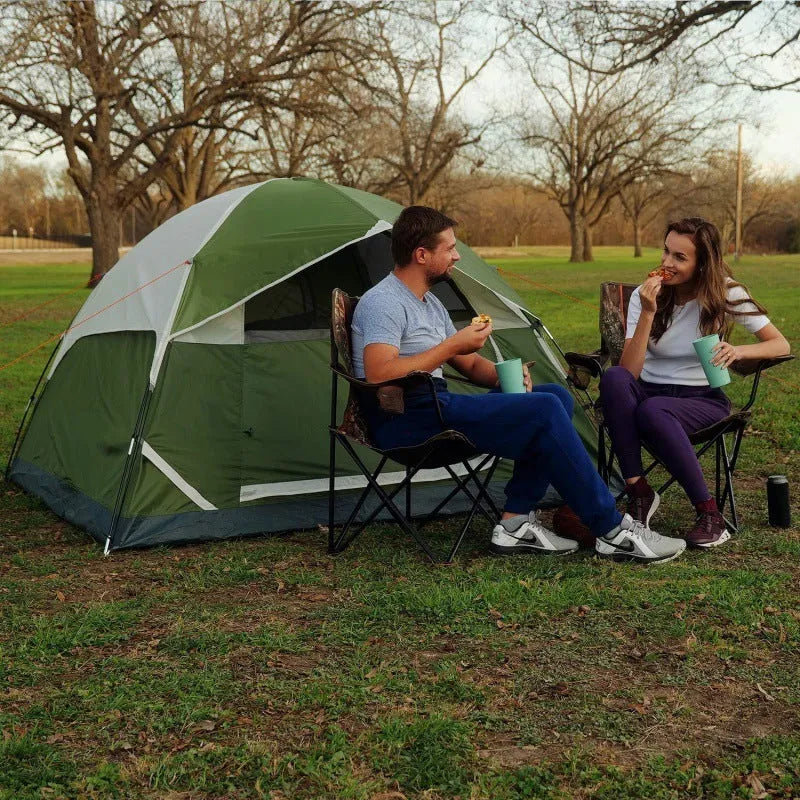 Orange portable 2-person camping tent with fibreglass poles set up outdoors