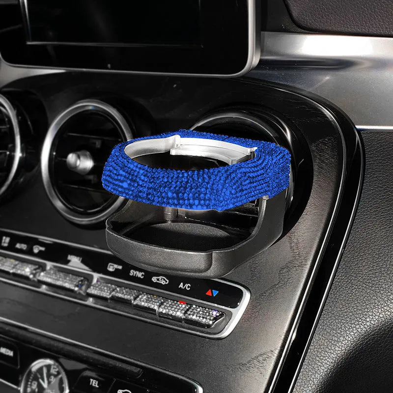 White rhinestone-decorated car cup holder bracket mounted on a car air vent