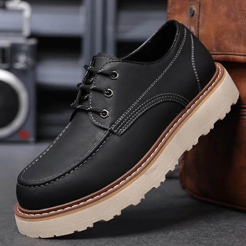 Men's black low-top casual boots with round toe and rubber sole