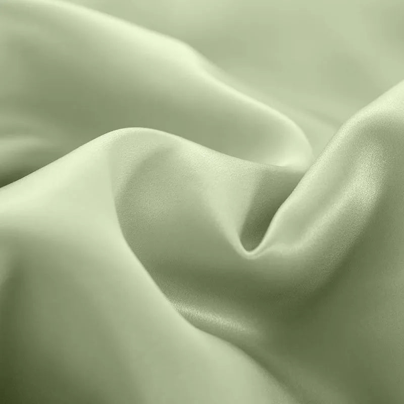 Reversible solid colour silk duvet cover shown in lotus pink, double-sided design.