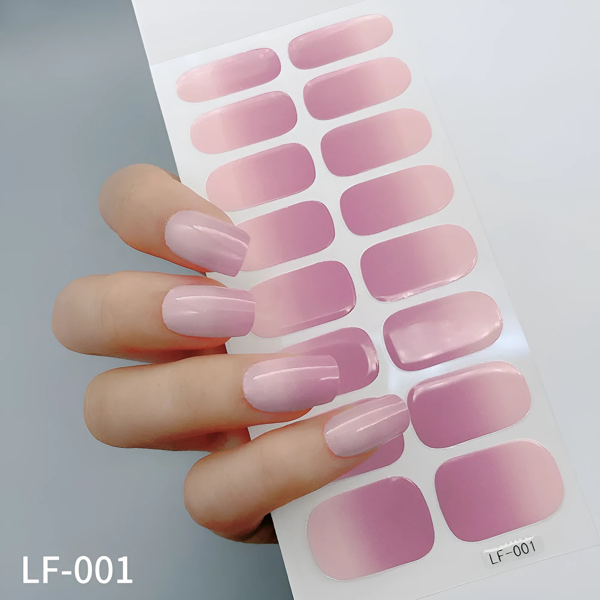 Set of 16 solid colour full nail art stickers showing patterns like cross, rose, tulip, and cartoon designs.